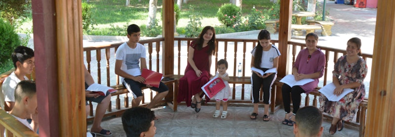 children are studying materials together